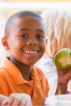 Child eating and apple