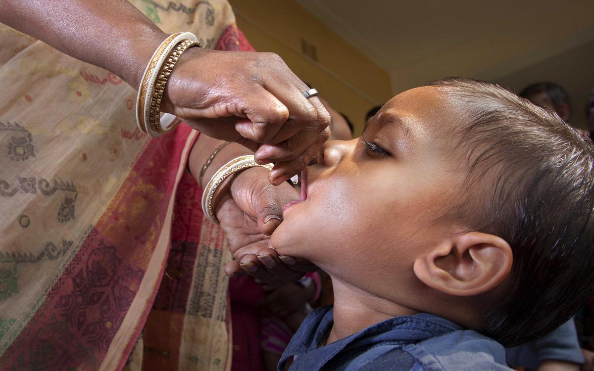 A child receives a polio vaccine in Cooch Behar, India