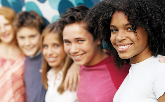 Cover of Teen Years Explained, group of diverse teens posing for camera.