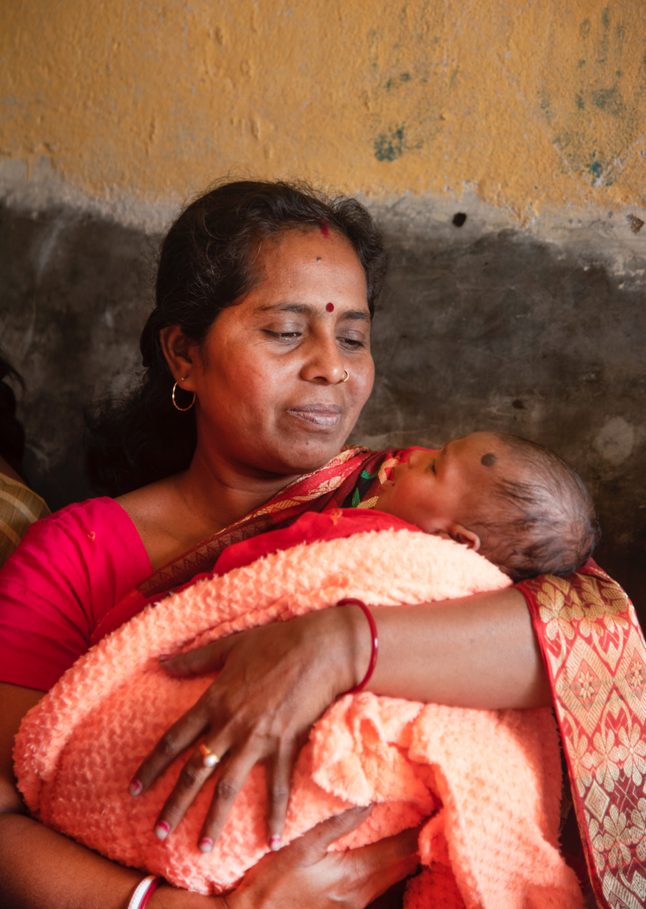 Mother holds baby