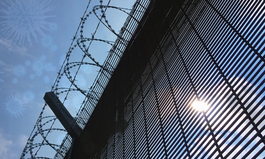 Prison walls with barbed wire