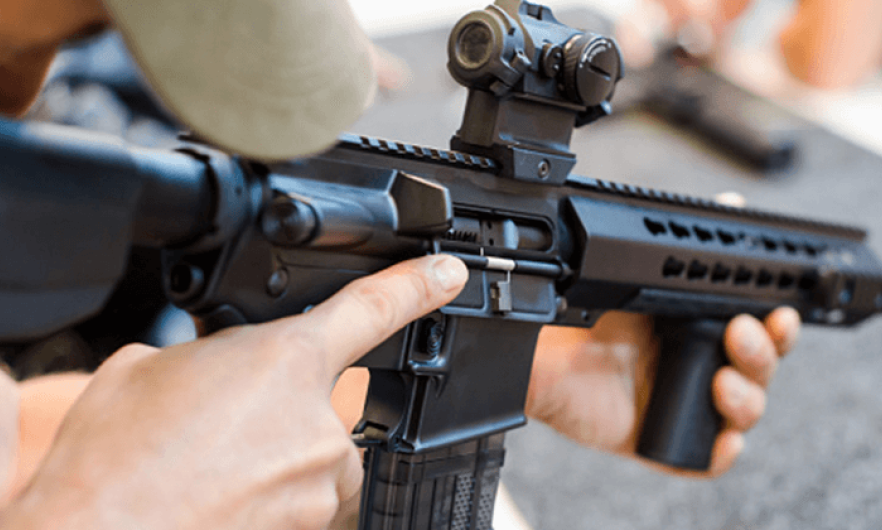 Close-up picture of a rifle in hand