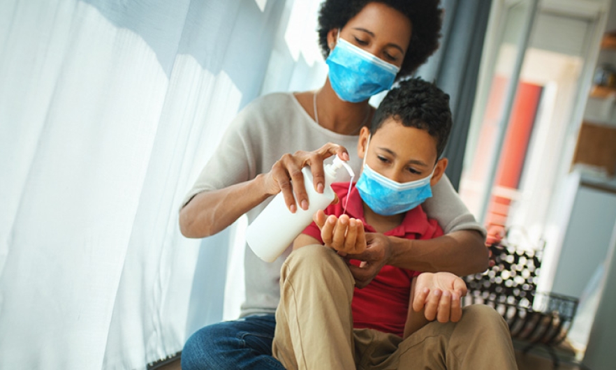 Person in a mask with child in a mask