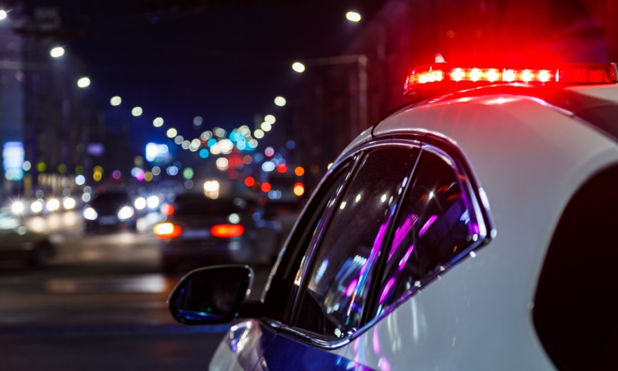 Police car on the road with lights on