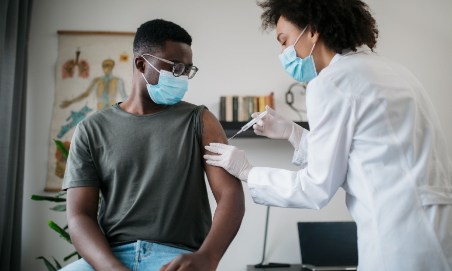 Patient receiving a vaccine at the doctor's office