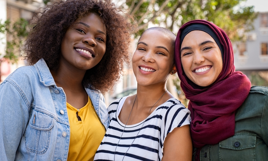 Three women smiling