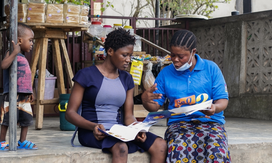 Photograph of two Nigerian women and a child.