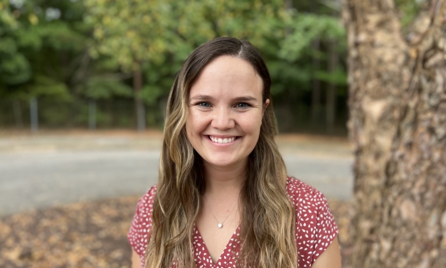 young woman outdoors smiling 