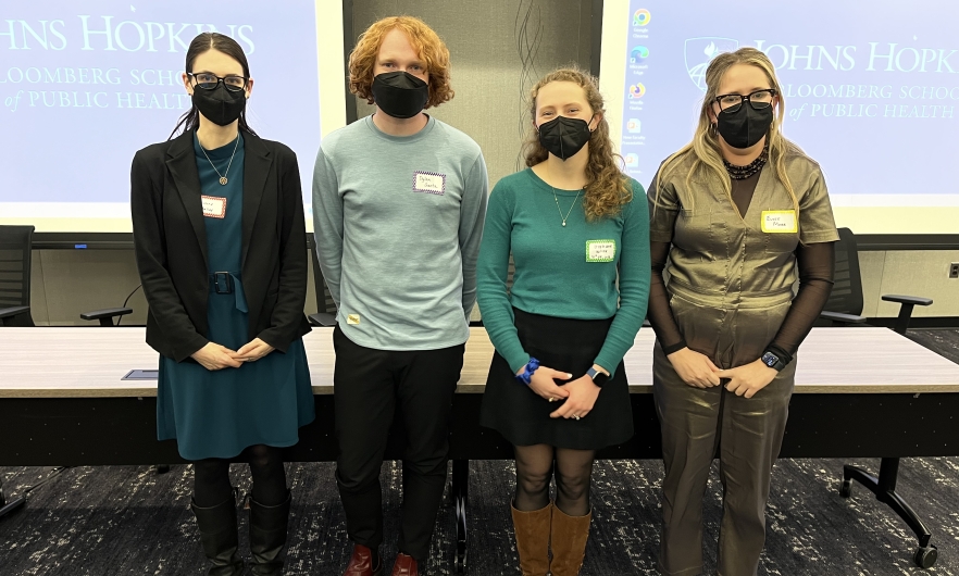 group of students standing in front of room 