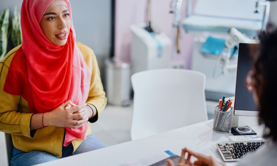 Patient talks with their doctor in a medical office