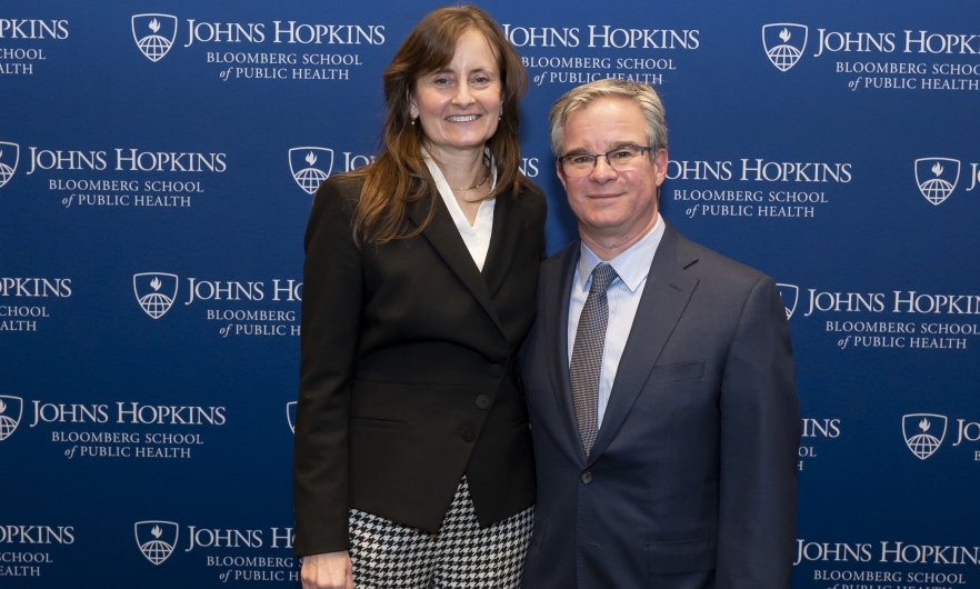 Shannon Frattaroli and Josh Horwitz in front of Johns Hopkins Bloomberg School of Public Health step-and-repeat