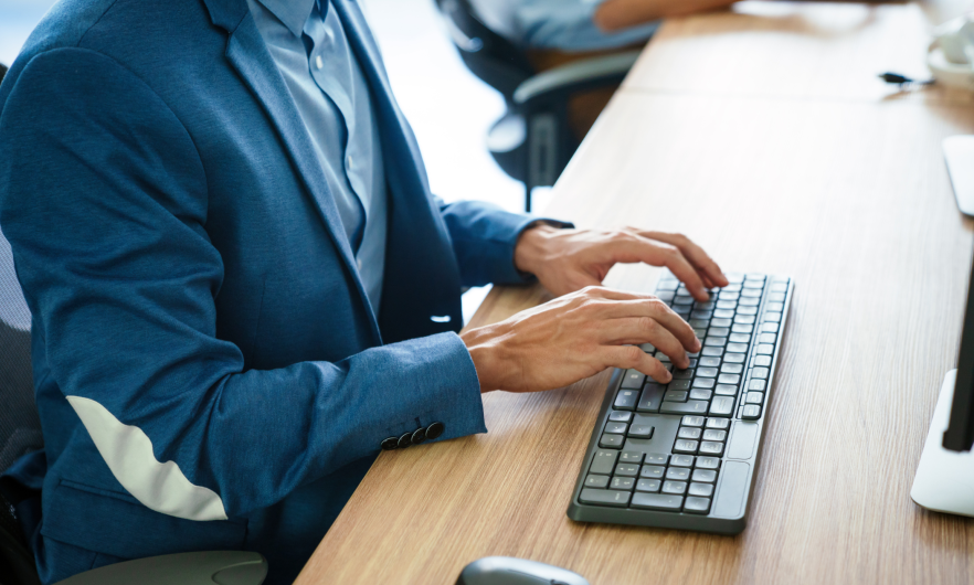 person typing on the computer