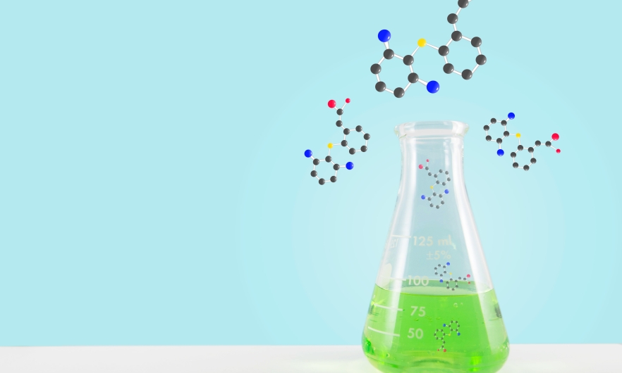 illustration of a flask with green liquid on a table with a blue background with multicolored bubbles coming out of it