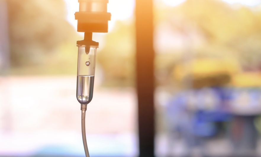 A photograph of an intravenous drip. 