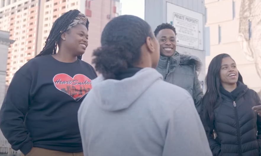 four young people in sweatshirts