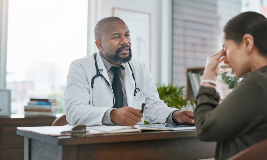 A frustrated patient sitting in front a doctor