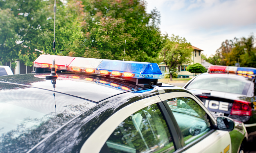 photo of two police cars 