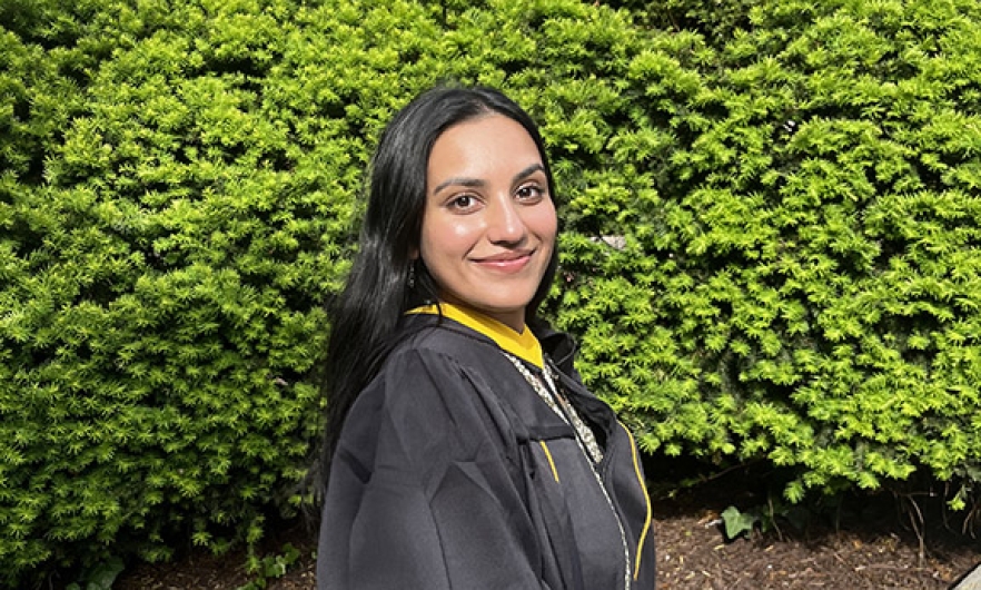 young woman wearing graduation gown