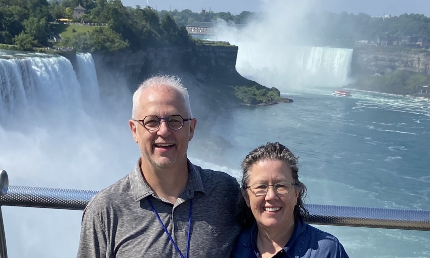 Eileen McDonald and husband David on a boat with Niagara Falls in the background