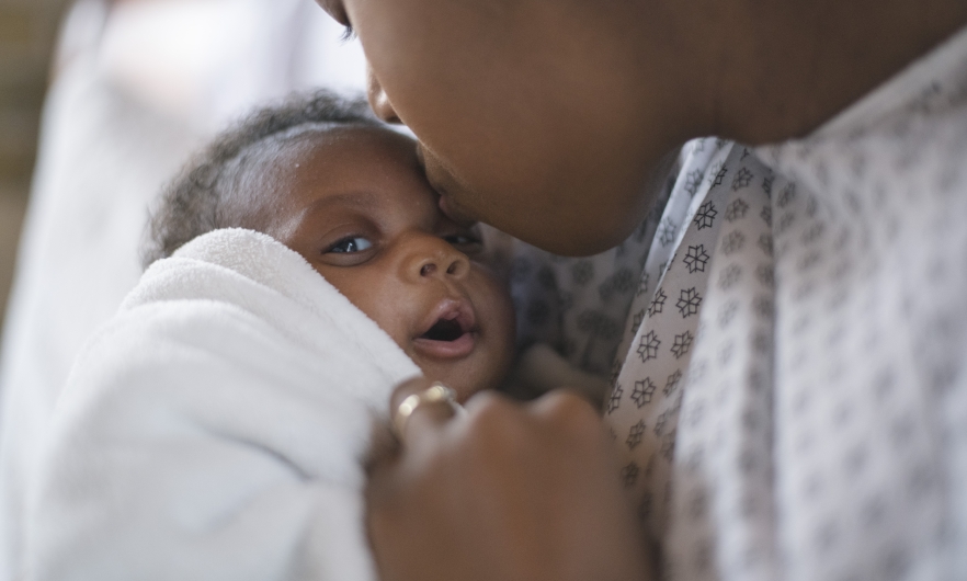 A newborn and mother in a hospital A newborn and mother in a hospital