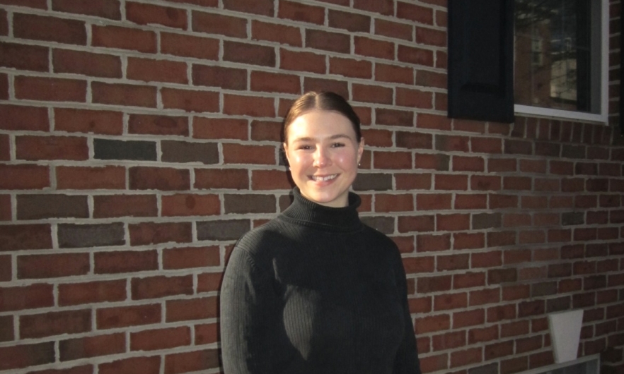 Young woman standing in front of building