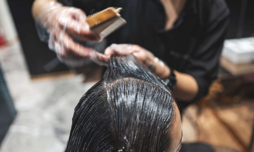 Image courtesy of Getty Images woman receiving service in a hair salon