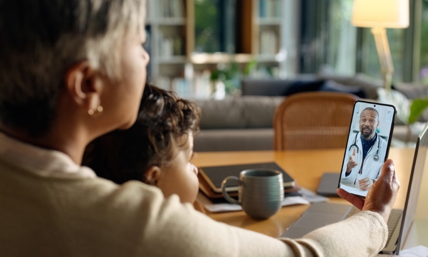 woman using smartphone for video Telehealth appointment
