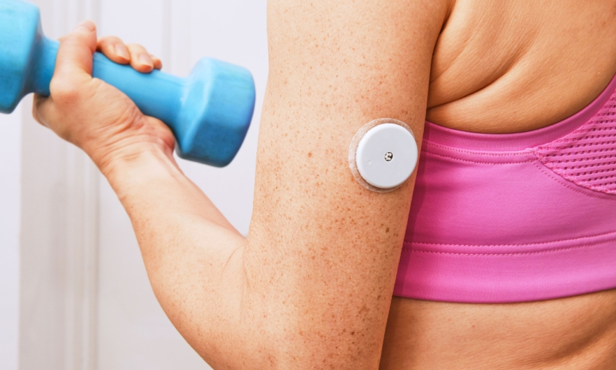 image of woman lifting a dumbbell