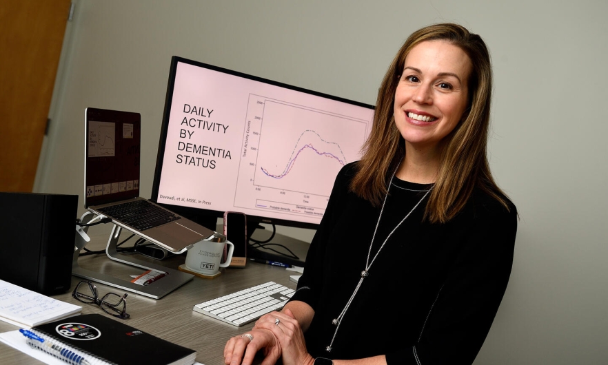 Dr. Jennifer Schrack sitting at desk