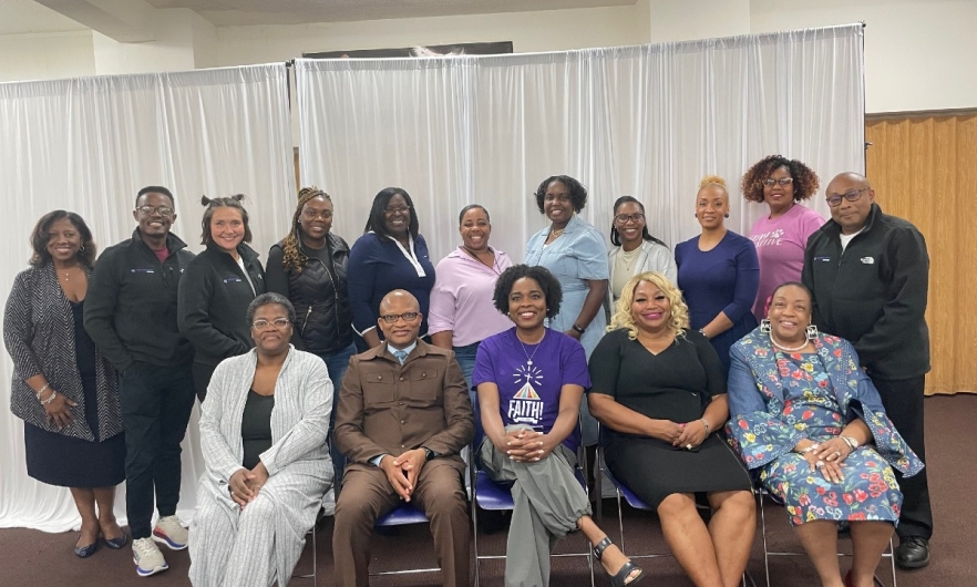 Techquity by FAITH group Group of men and women sitting and standing