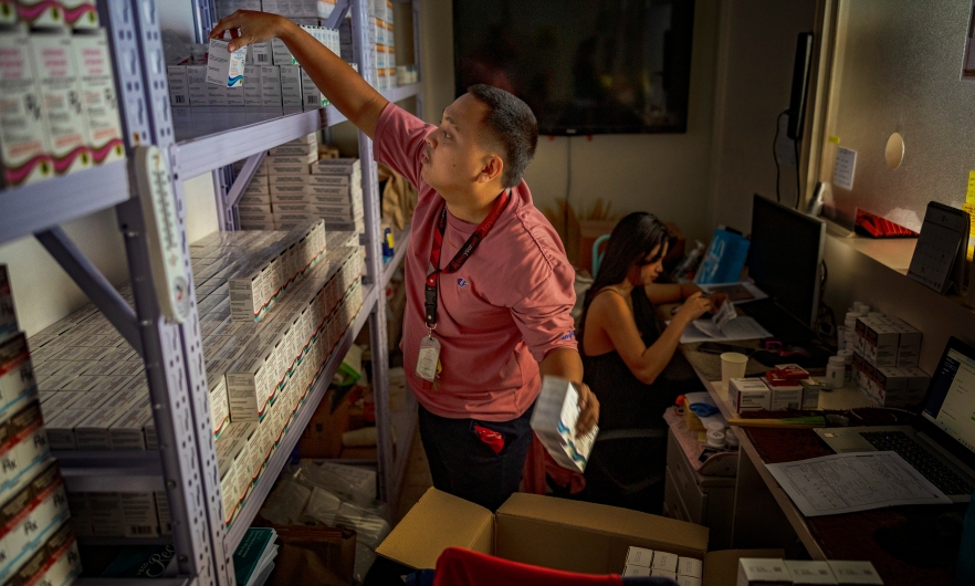 A pharmacist stocks PrEP medicine at a pharmacy in a community center operated by LoveYourself, a nonprofit impacted by the Trump administration&#039;s freeze on foreign aid, on February 19, 2025, in Mandaluyong, Metro Manila, Philippines