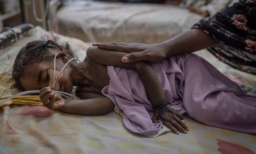 Two-year-old Riham Ata, who was admitted from a recently liberated area of Khartoum, lies on a gurney in one of Al-Buluk Hospital&#039;s severe malnutrition wards, in Omdurman, Sudan, on April 26, 2025