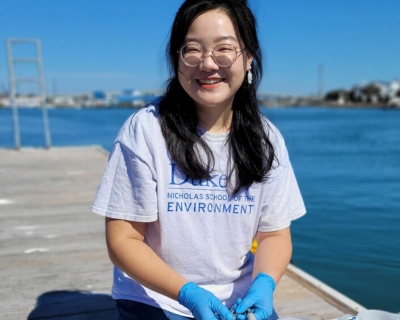 Female on a dock with test tubes