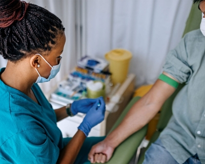 Patient with tourniquet getting blood drawn