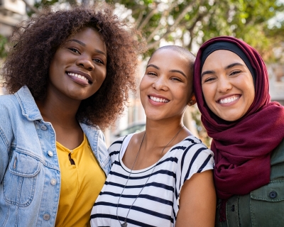 Three women smiling