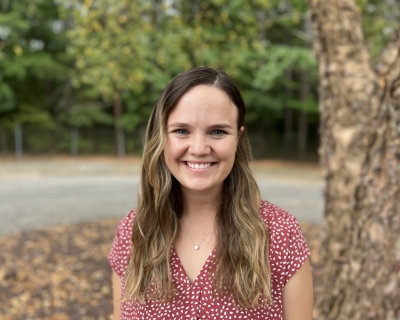 young woman outdoors smiling 