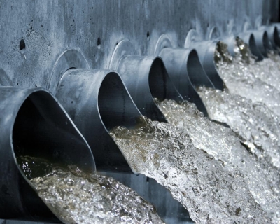 Water coming out of large outdoor pipes