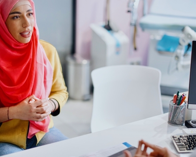 Patient talks with their doctor in a medical office