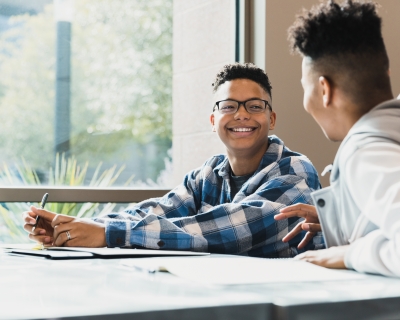 Two young boys at a desk 