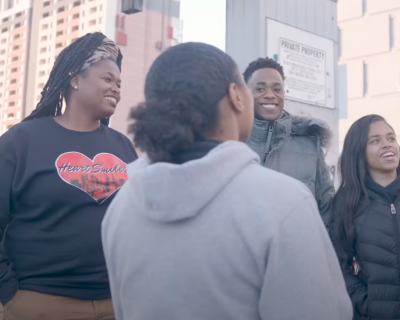 four young people in sweatshirts