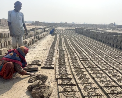 Brick kiln workers laying bricks in Pakistan