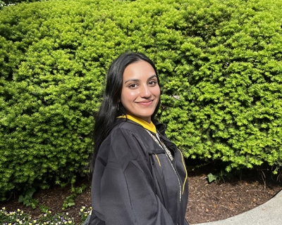 young woman wearing graduation gown