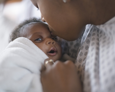 A newborn and mother in a hospital A newborn and mother in a hospital