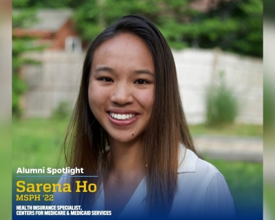 A headshot of a woman wearing a white collared shirt