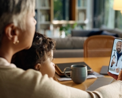 woman using smartphone for video Telehealth appointment