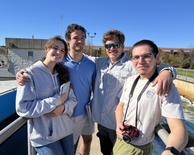 group shot of one young female and four young males