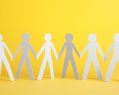 A paper stick figure chain of people holding hands