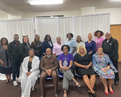 Techquity by FAITH group Group of men and women sitting and standing