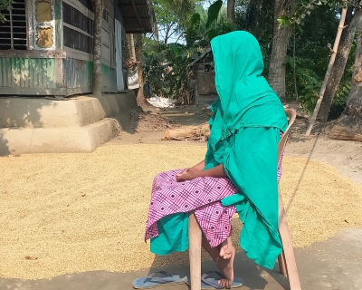 Parveen Akhtar sits in front of her storm-battered home in Teligati village on Dec. 29, 2022. Ritwika Mitra 