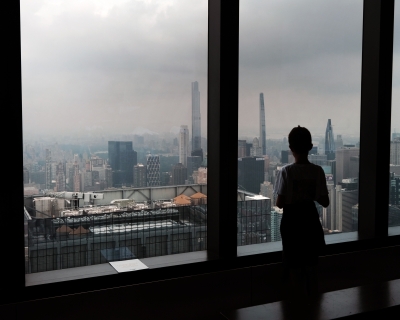 A child looks out at a hazy skyline from an overlook in midtown Manhattan on July 19, 2023 in New York City.